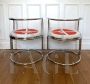 Pair of armchairs by Gae Aulenti in chromed steel                            
