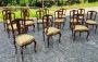 Set of 12 chairs + 2 head chairs in Palladian style inlaid with allegorical cherubs