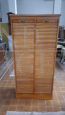 Vintage double roller shutter cabinet from the 1950s