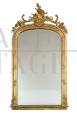 Antique Napoleon III mirror in gilded wood and carved with rocailles and roses