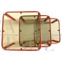 Trio of nest tables in red iron and smoked glass, 1980s