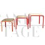 Trio of nest tables in red iron and smoked glass, 1980s