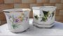 Pair of vintage ceramic vases with floral decorations