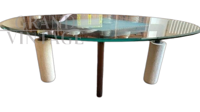 Tavolo design ovale con piano in vetro e gambe in pietra, anni '80                            