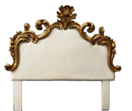 Antique bed headboard upholstered in white fabric and carved with gold leaf                         
                            