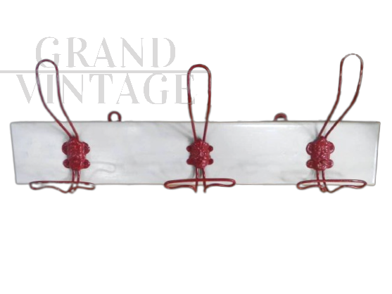White vintage wall coat rack with 3 red decorated hooks