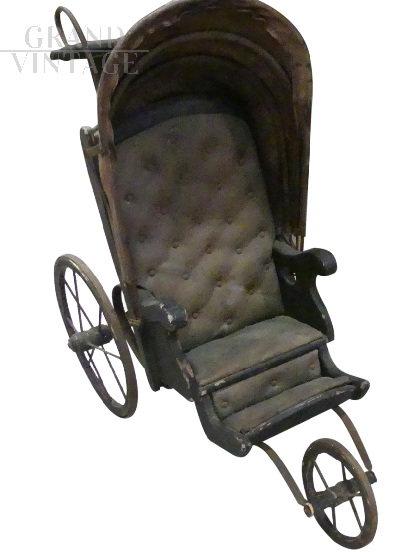 Antique toy stroller pram from the 19th century