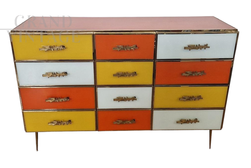 Dresser with 12 drawers in yellow and orange colored glass