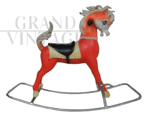 Vintage rocking horse made of plastic