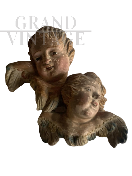 Antique cherubic angels in original state