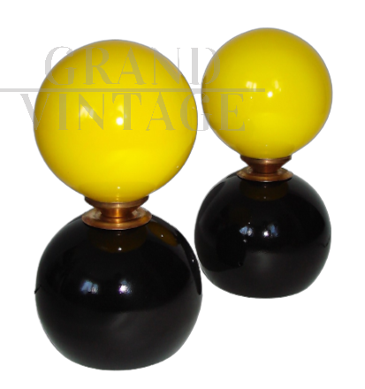 Pair of 70's table lamps with yellow glass spheres    
                            