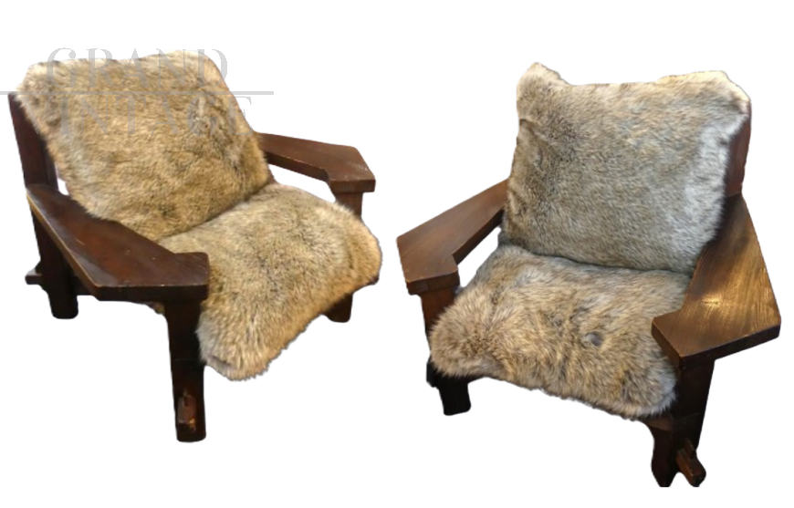 Pair of design armchairs in wood and rope with faux fur cushions