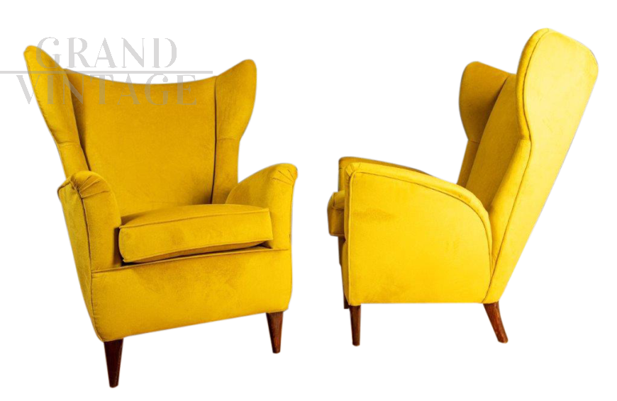 Pair of ISA armchairs covered in ocher yellow velvet