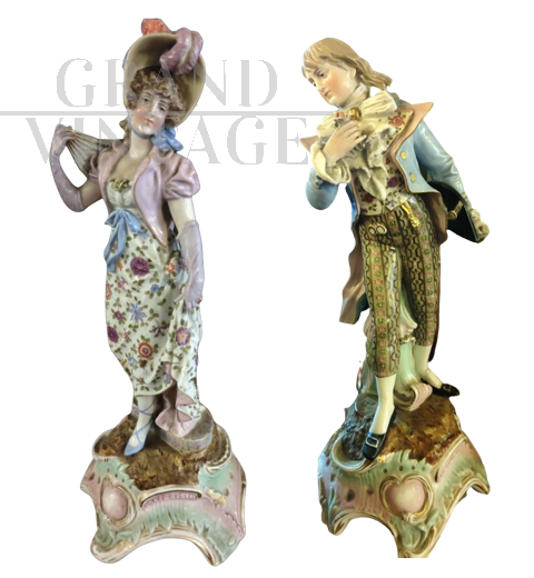 Pair of 19th century porcelain statues with characters 