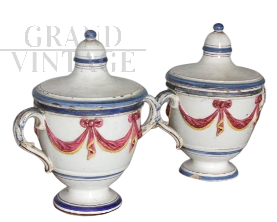 Pair of 18th century glazed terracotta spice jars with festoons