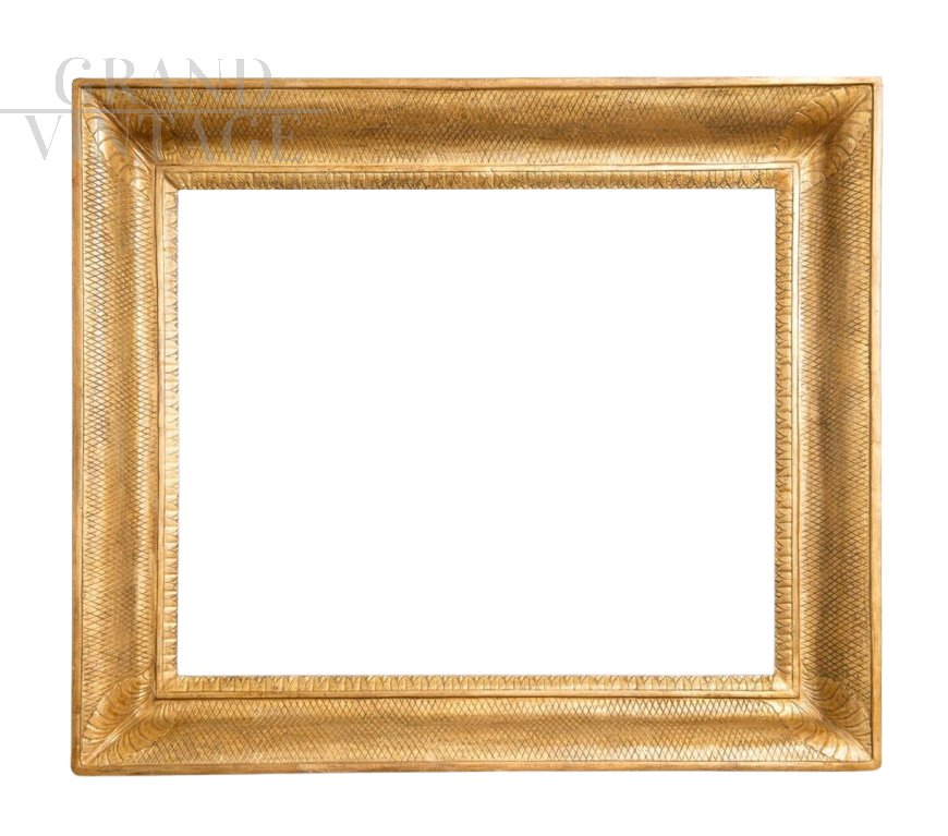 Antique Empire frame in gilded and carved wood