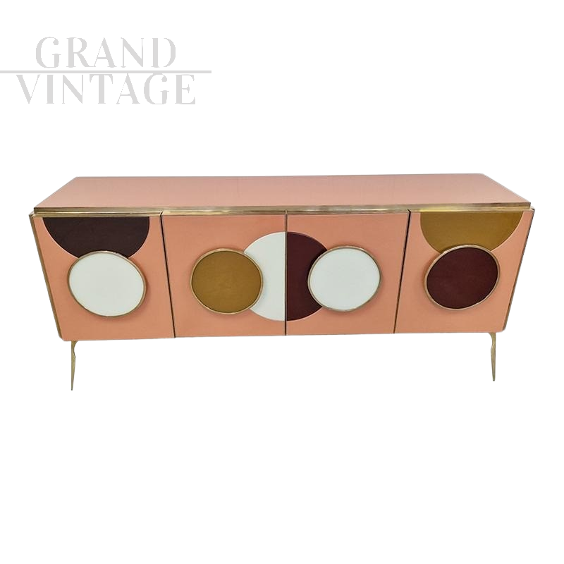 Illuminated sideboard in colored glass decorated with circles