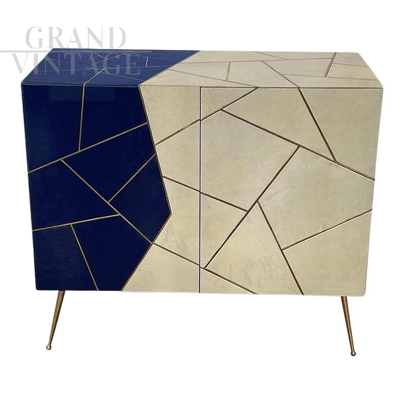 Sideboard in ivory and blue glass and parchment