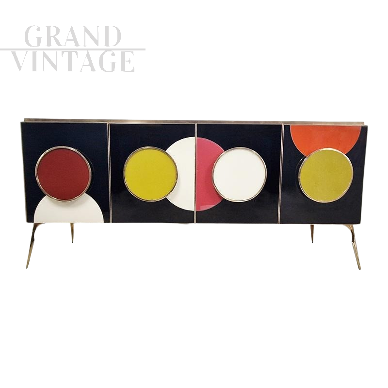Backlit sideboard in black glass with colored circles   