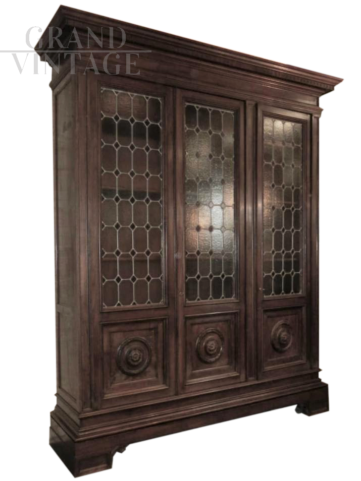 Large 1950s walnut bookcase with leaded glass doors