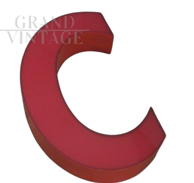 Vintage red plastic letter C from a 1970s sign