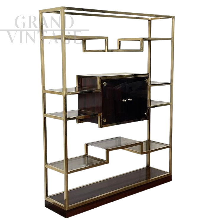 Design bookcase in brass and makassar with central display case