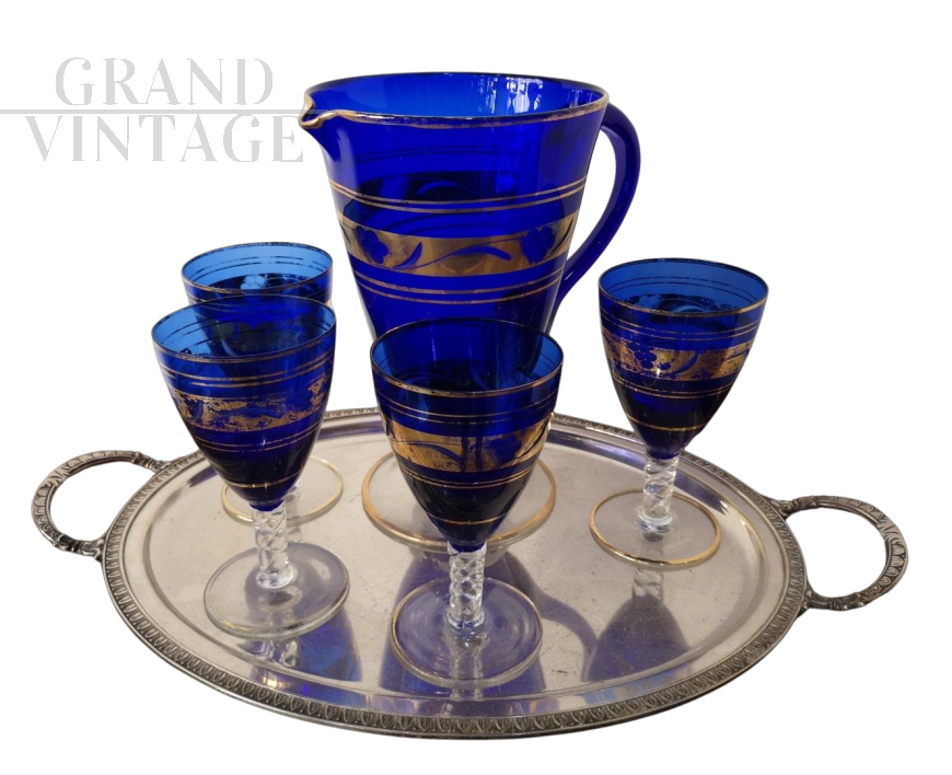 Set of glasses and carafe in blue Murano glass with gold decorations, mid-19th century