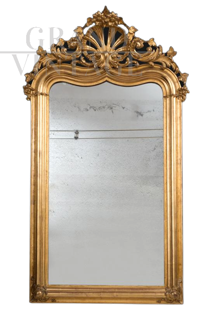 Antique Louis Philippe mirror in gilded and carved wood