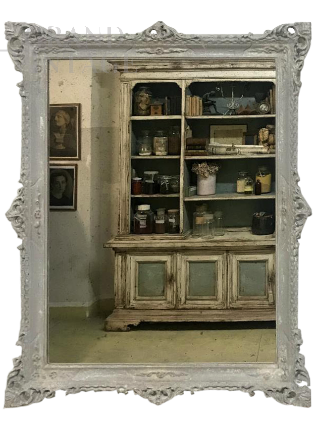 Carved and decorated mirror