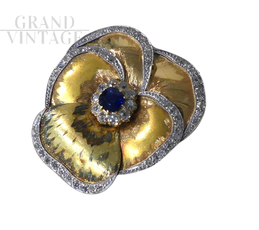 1960s brooch in gold in the shape of a violet with diamonds and sapphire