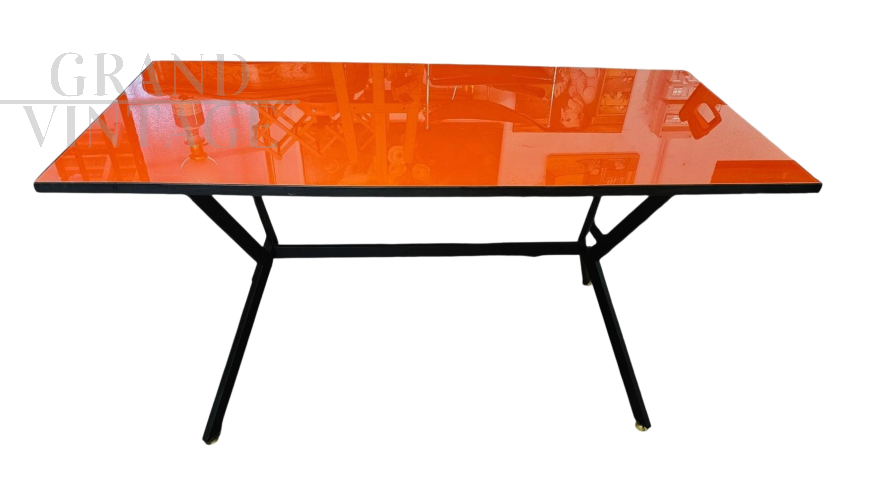 1960s iron table with orange glass top