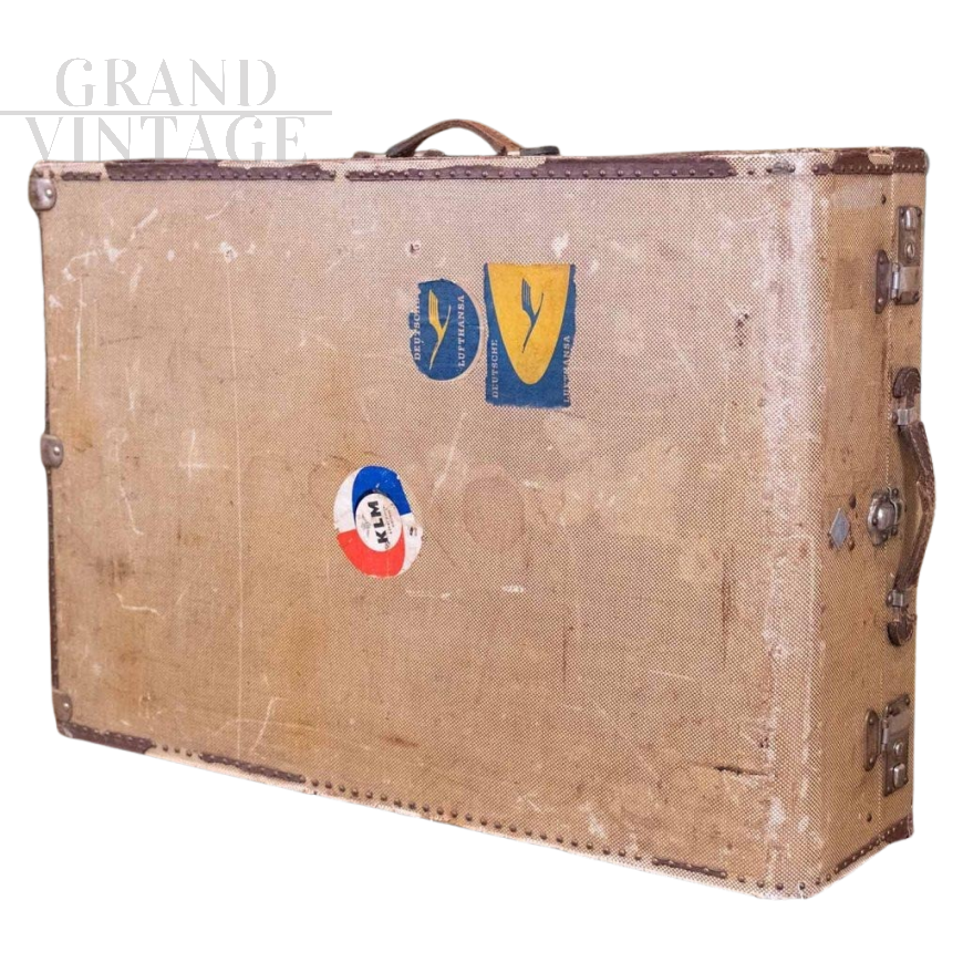 Vintage riveted beige fabric suitcase with stickers