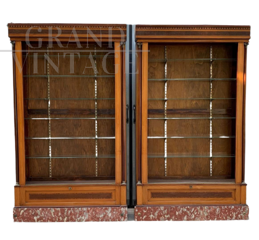 Early 1900s display cabinets with bronzes and marble base